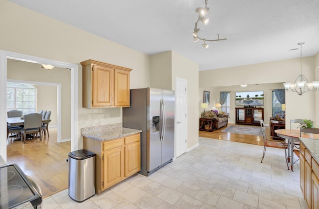 103 Trimley Ct, Goose Creek, SC 29445 - kitchen with stainless steel refrigerator with ice dispenser, electric range, open floor plan, a chandelier, and light brown cabinetry