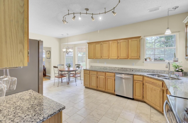 103 Trimley Ct, Goose Creek, SC 29445 - kitchen with stainless steel dishwasher, a sink, stove, and light stone countertops
