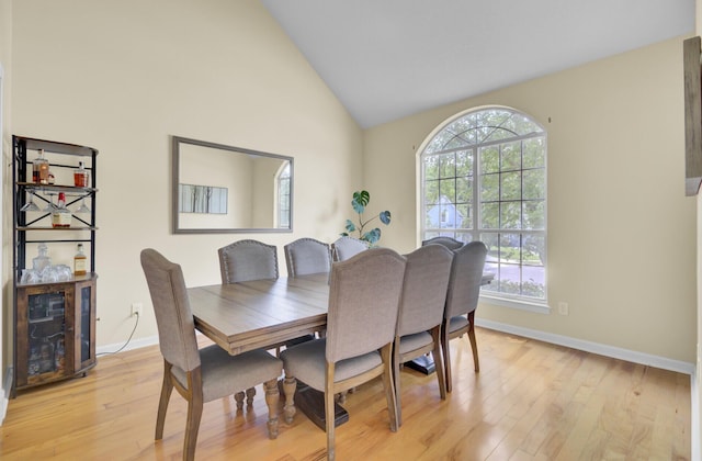 103 Trimley Ct, Goose Creek, SC 29445 - dining room featuring light wood-style floors, baseboards, and high vaulted ceiling