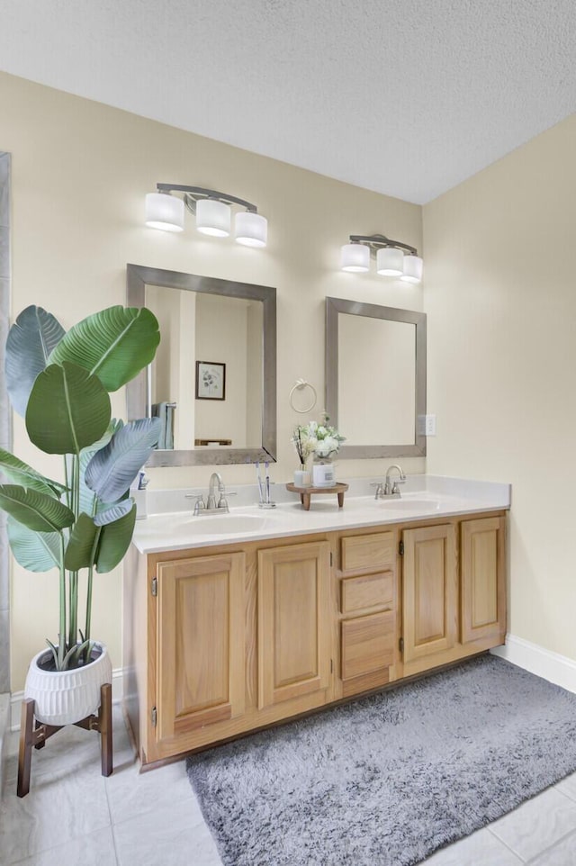 103 Trimley Ct, Goose Creek, SC 29445 - full bath with double vanity, tile patterned floors, baseboards, and a textured ceiling