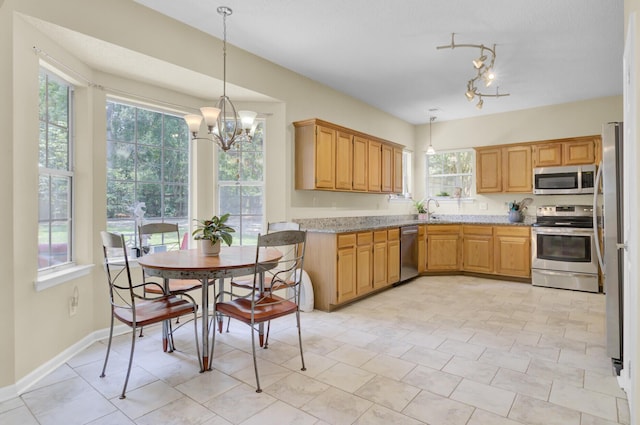 103 Trimley Ct, Goose Creek, SC 29445 - kitchen with appliances with stainless steel finishes, a chandelier, a sink, pendant lighting, and baseboards