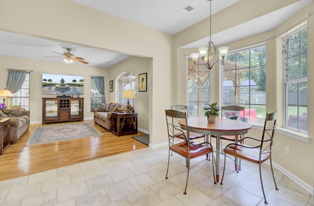 103 Trimley Ct, Goose Creek, SC 29445 - dining area featuring healthy amount of natural light, a chandelier, wood finished floors, and baseboards