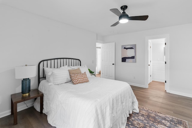 bedroom featuring dark hardwood / wood-style flooring and ceiling fan