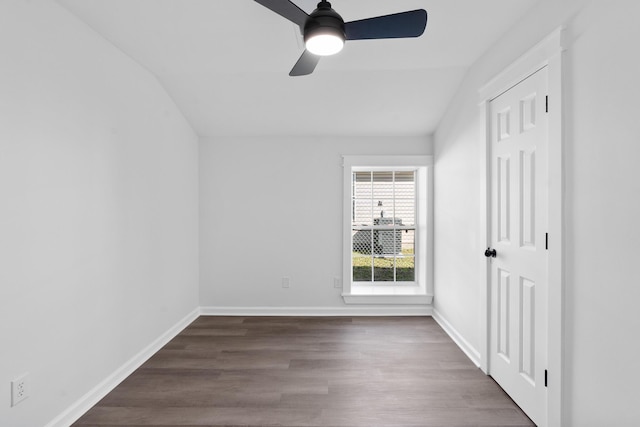 unfurnished room with ceiling fan, hardwood / wood-style floors, and vaulted ceiling