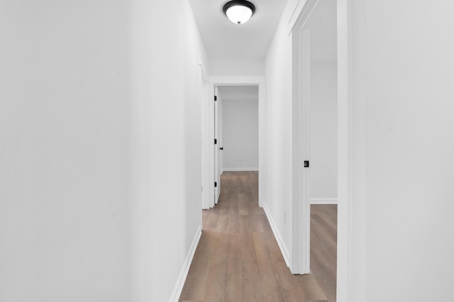 corridor featuring light hardwood / wood-style floors