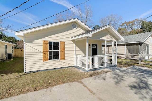 bungalow-style house featuring central AC and covered porch