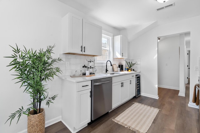 kitchen featuring white cabinets, beverage cooler, dishwasher, and sink