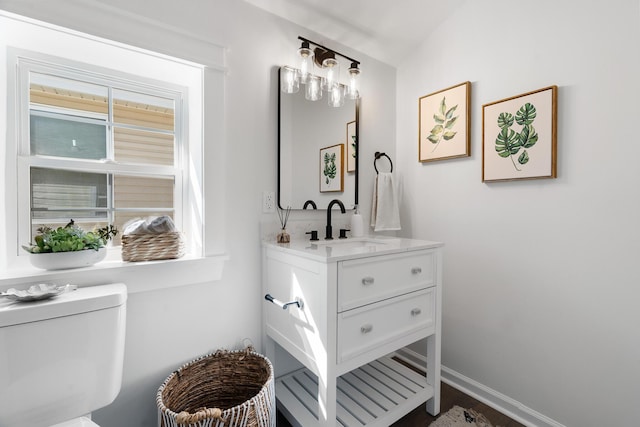 bathroom with vanity and toilet