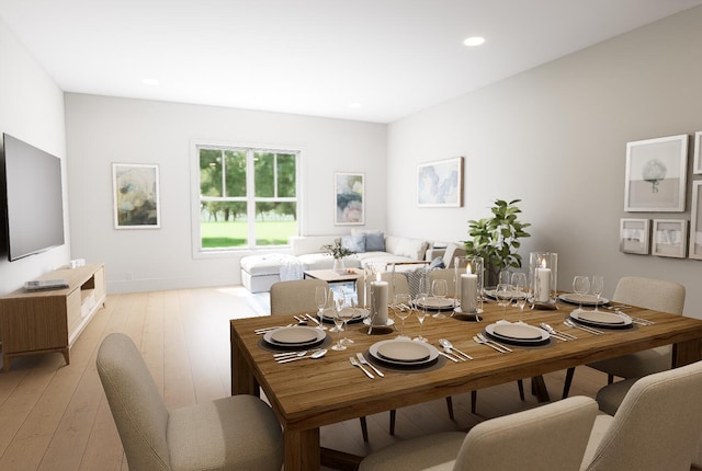 dining space with light wood-style flooring and recessed lighting