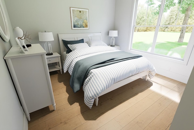 bedroom featuring light wood-style floors