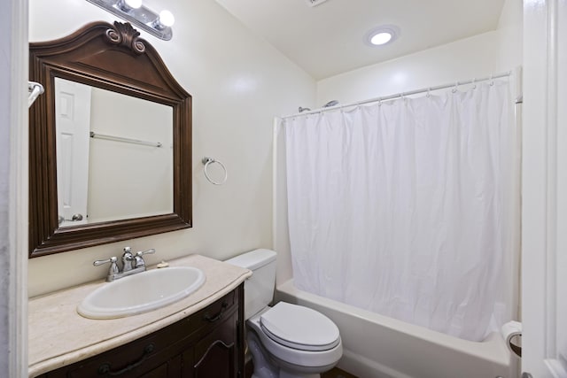 full bathroom featuring toilet, vanity, and shower / bath combination with curtain