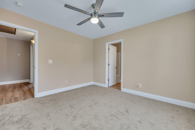 carpeted empty room with ceiling fan