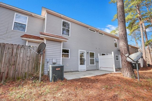 rear view of property with a patio and central air condition unit