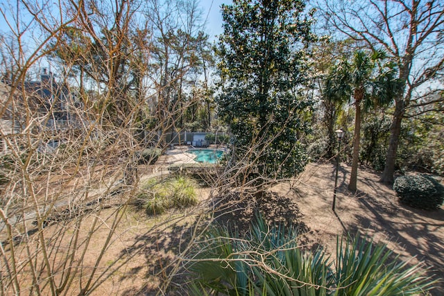 exterior space featuring a patio area and a fenced in pool