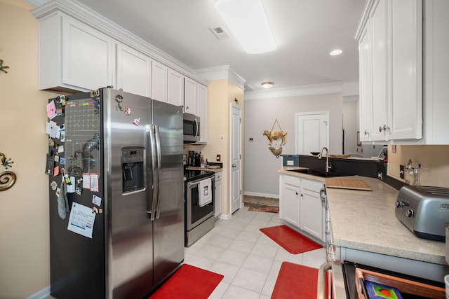 3364 Middlesboro Ave, Summerville, SC 29485 - kitchen featuring a sink, appliances with stainless steel finishes, white cabinets, ornamental molding, and light tile patterned floors