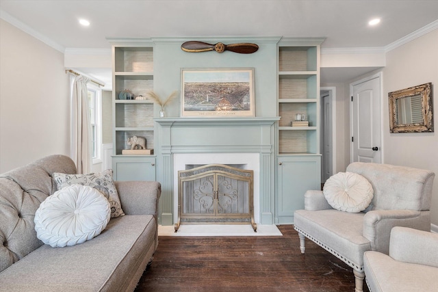 living area with crown molding and dark hardwood / wood-style floors