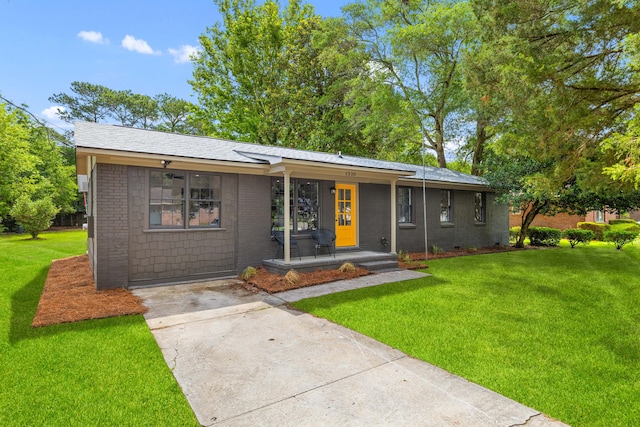 1320 Bresee St, Charleston, SC 29412 - single story home featuring a front lawn, brick siding, driveway, and covered porch