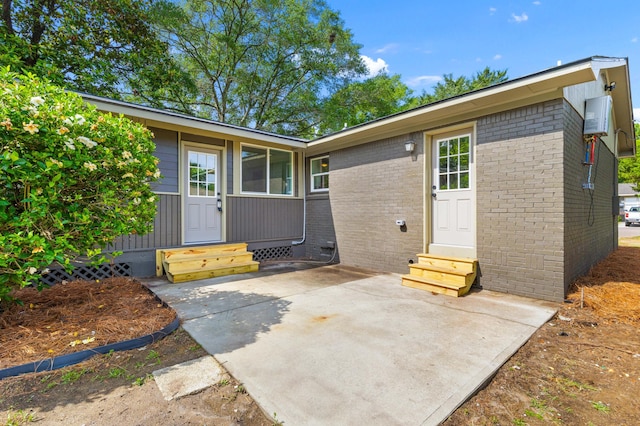 1320 Bresee St, Charleston, SC 29412 - property entrance with brick siding and a patio