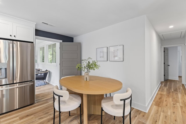 1320 Bresee St, Charleston, SC 29412 - dining area with attic access, light wood-style flooring, and baseboards