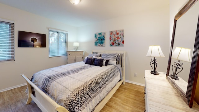 bedroom with hardwood / wood-style floors