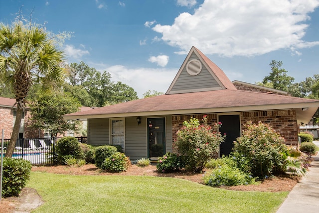 view of front of home with a front lawn