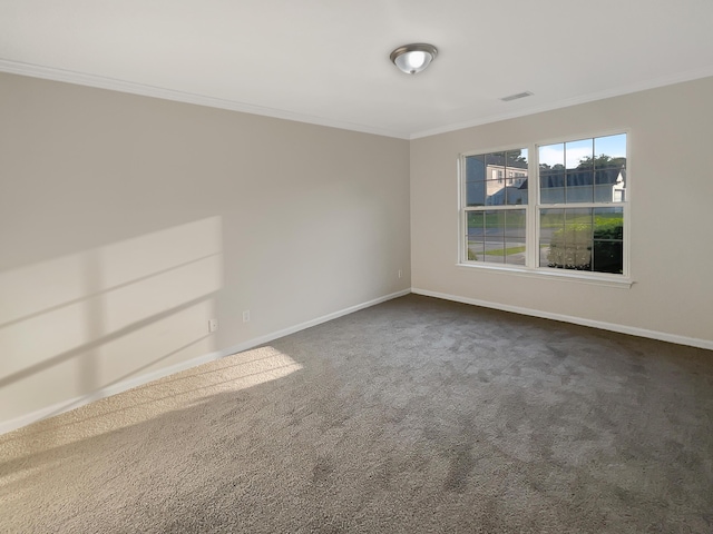 carpeted empty room featuring crown molding