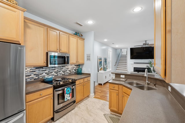 907 High Nest Ln, Charleston, SC 29412 - kitchen featuring stainless steel appliances, ceiling fan, open floor plan, light marble finish flooring, and backsplash
