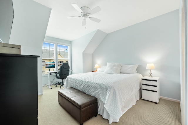 bedroom with ceiling fan and light carpet