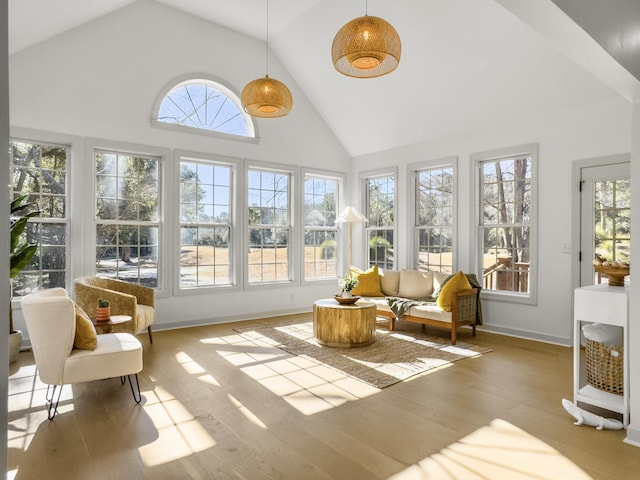 sunroom / solarium featuring vaulted ceiling