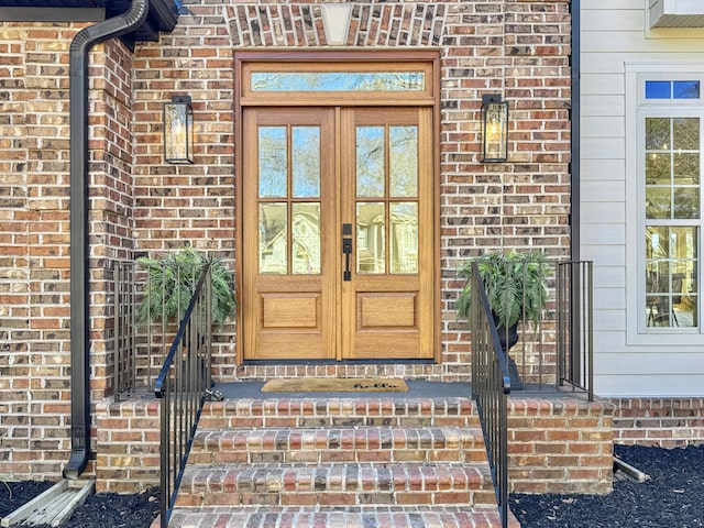 entrance to property with french doors and brick siding