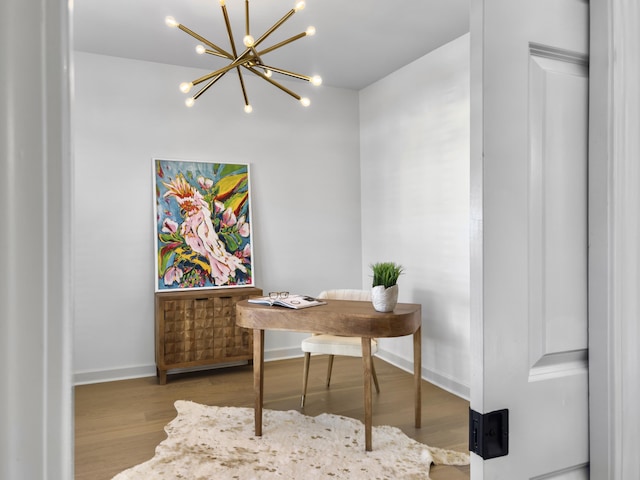 office area featuring baseboards and wood finished floors