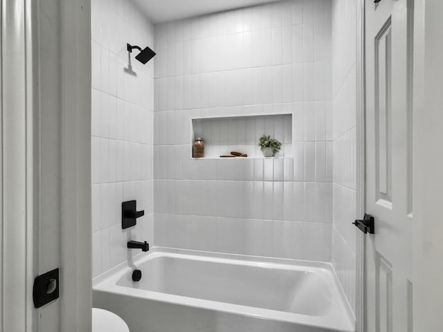 bathroom featuring toilet and shower / bathing tub combination