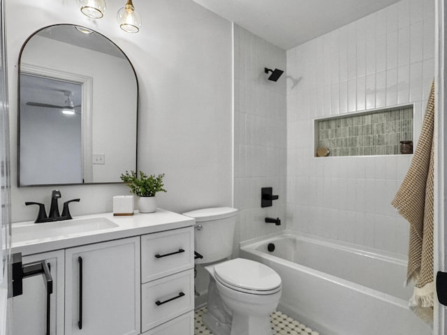 bathroom featuring toilet, shower / washtub combination, and vanity