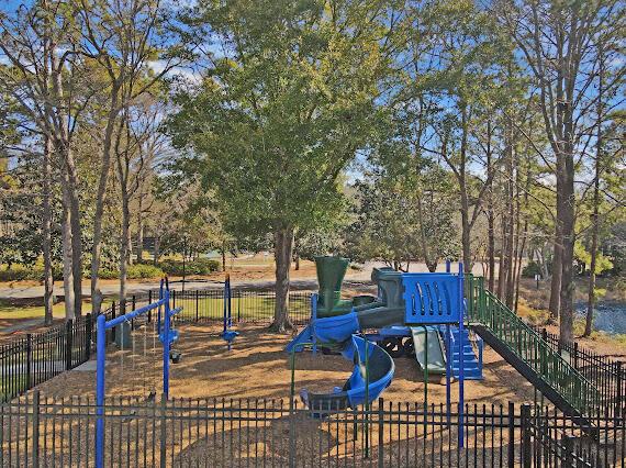 communal playground featuring fence