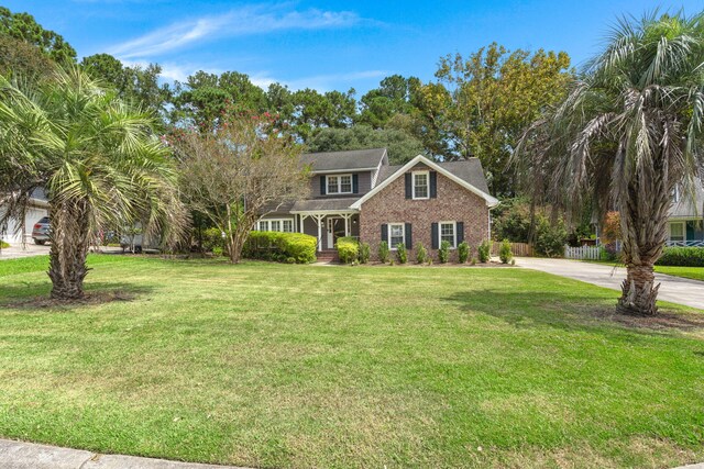 colonial-style house with a front lawn