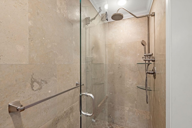 bathroom featuring a stall shower and ornamental molding