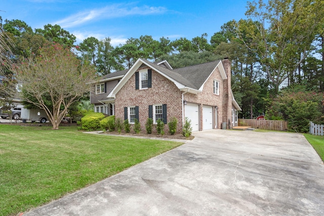 view of front of home with brick siding, a chimney, fence, driveway, and a front lawn