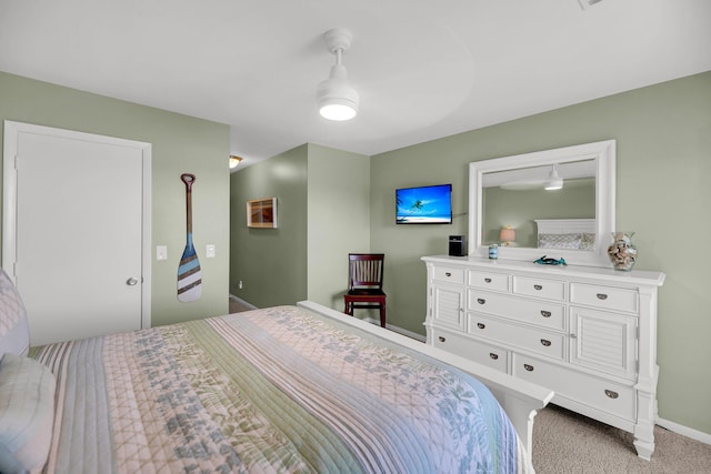 bedroom with light carpet and ceiling fan