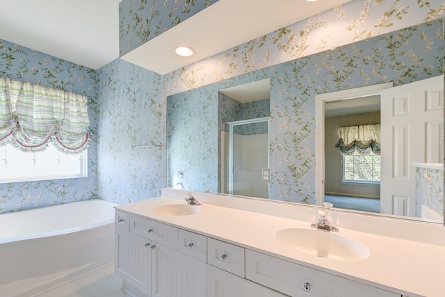 bathroom featuring independent shower and bath, vanity, and tile patterned floors