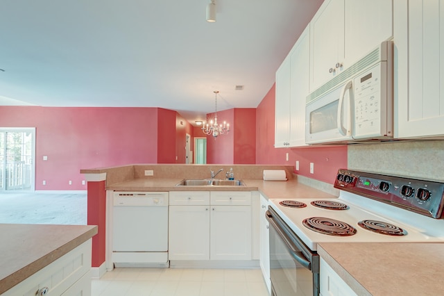 kitchen featuring white cabinets, white appliances, decorative light fixtures, and sink