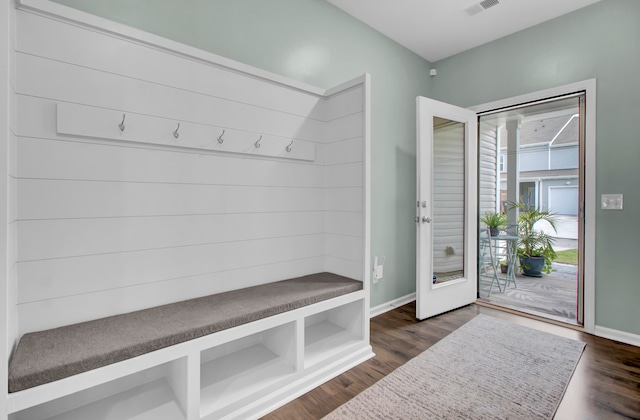 mudroom with dark hardwood / wood-style floors