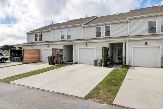 multi unit property with a garage and cooling unit