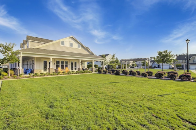 exterior space with a front yard and a pergola