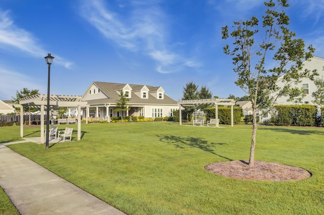 view of front of home featuring a pergola and a front yard