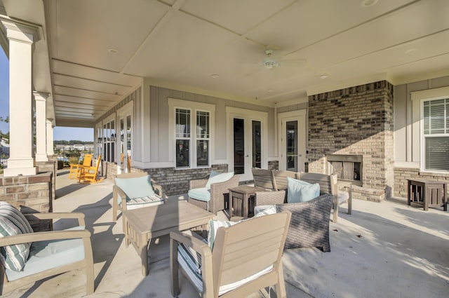 view of patio / terrace with an outdoor living space with a fireplace