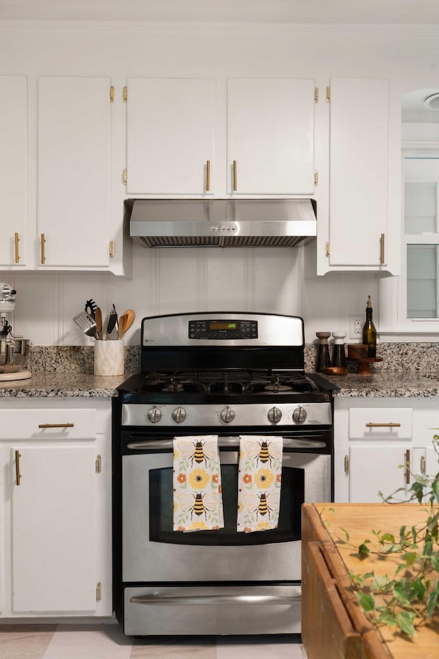 1417 Downing St, Charleston, SC 29407 - kitchen featuring stainless steel gas stove, range hood, white cabinetry, and light stone countertops