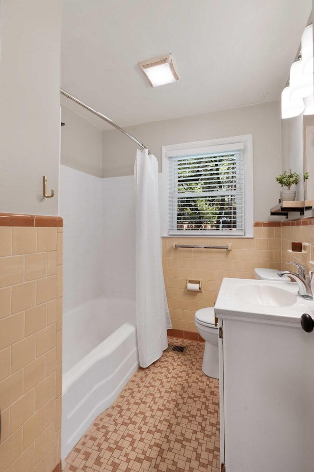 1417 Downing St, Charleston, SC 29407 - bathroom with tile walls, vanity, a wainscoted wall, shower / bath combo, and tile patterned floors