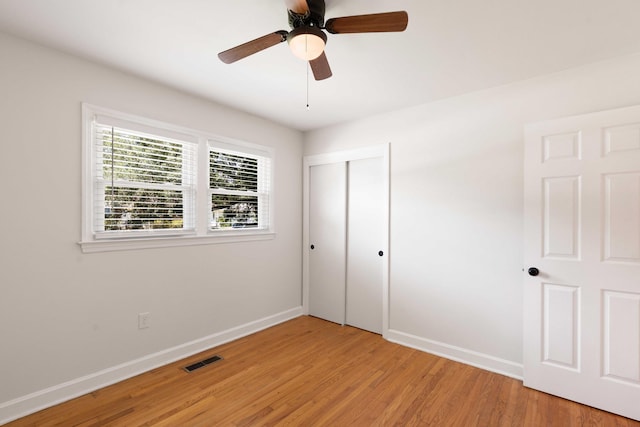 1417 Downing St, Charleston, SC 29407 - unfurnished bedroom with light wood finished floors, a closet, and a ceiling fan