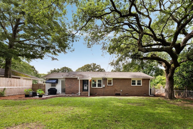 1417 Downing St, Charleston, SC 29407 - rear view of house with crawl space, a fenced backyard, brick siding, and a patio