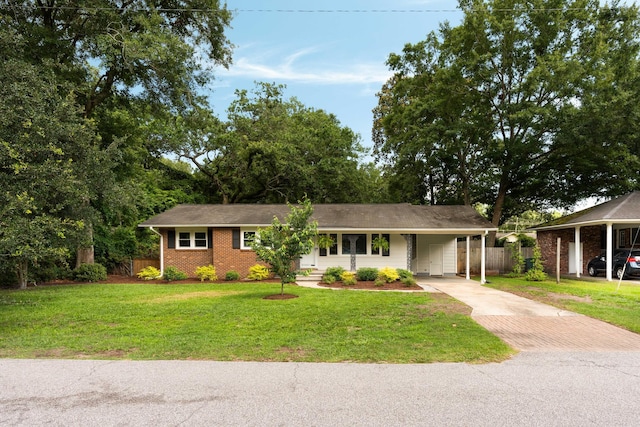 1417 Downing St, Charleston, SC 29407 - ranch-style home featuring asphalt driveway, a carport, and brick siding